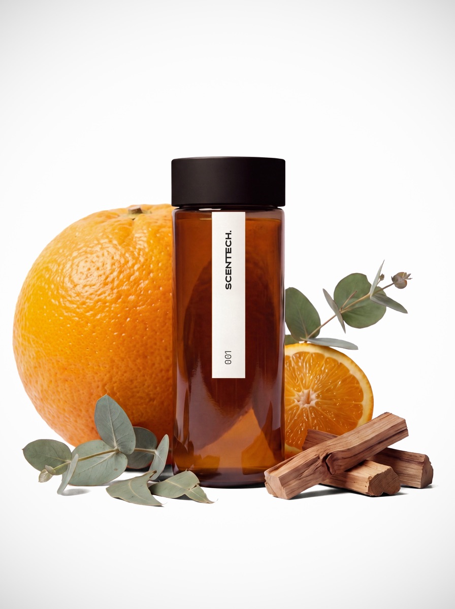 Een ScentPod 2.0 van 65 ml met de geur Clean Energy, staand naast de verpakking